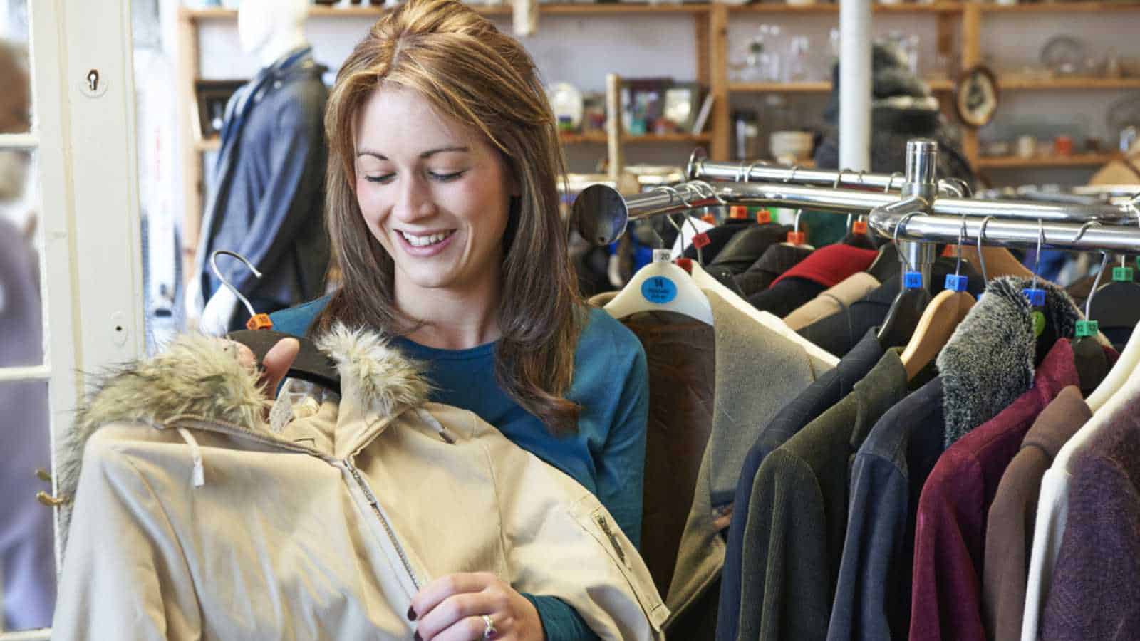 Woman buying second hand clothes