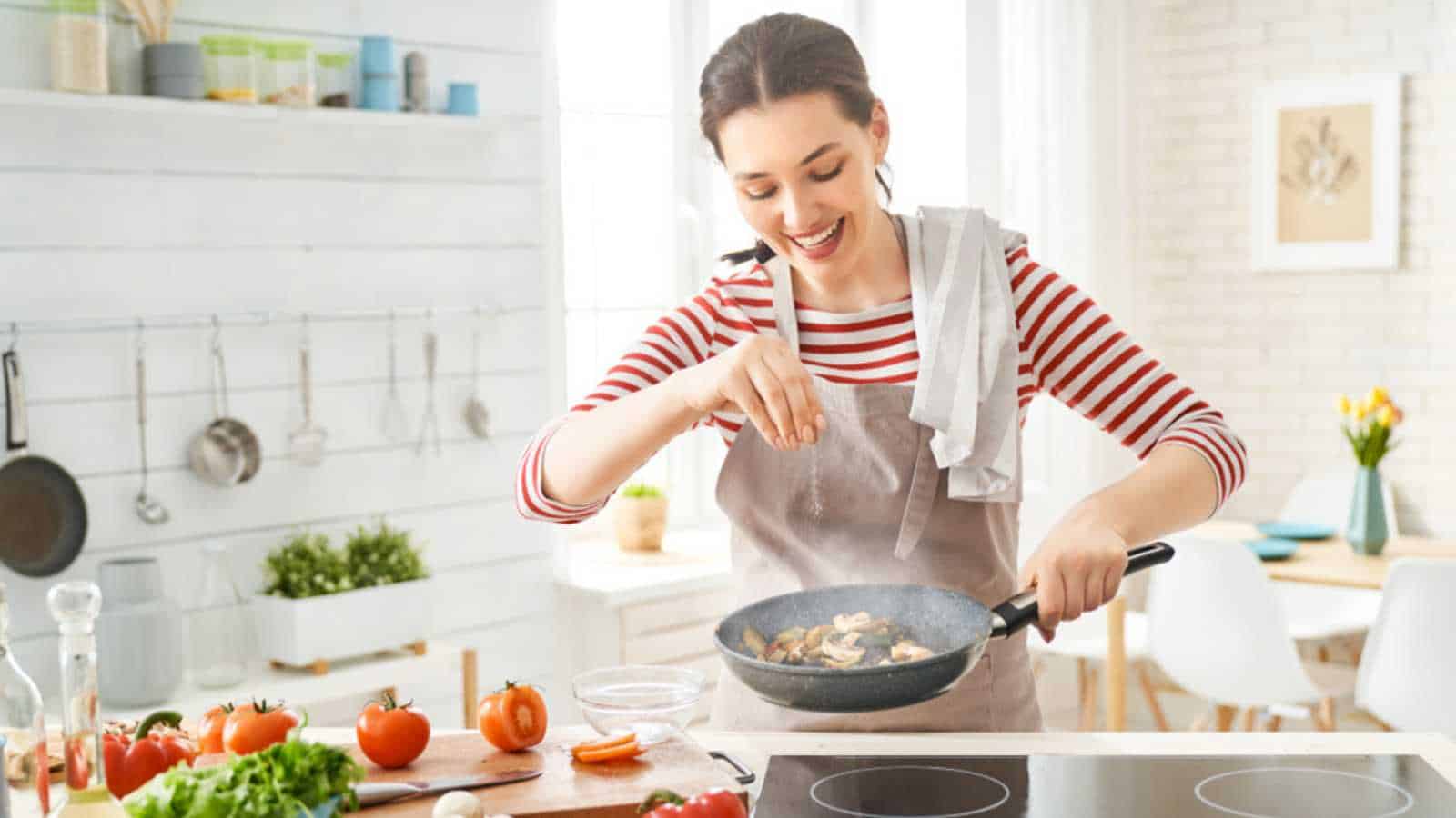 Woman cooking in kitchen
