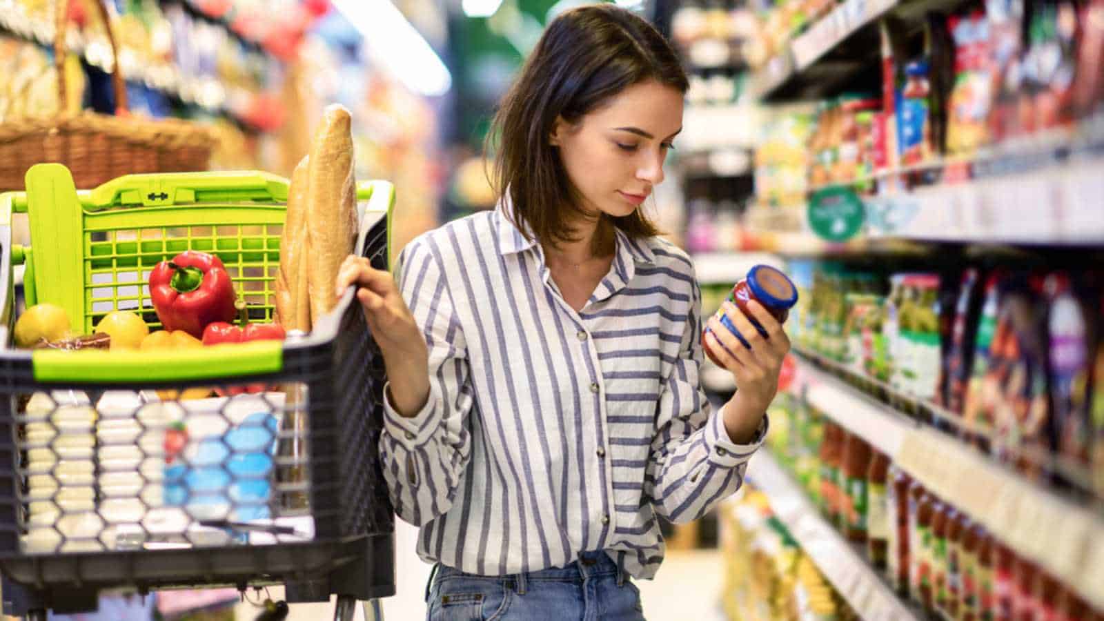 Woman purchasing in grocery store