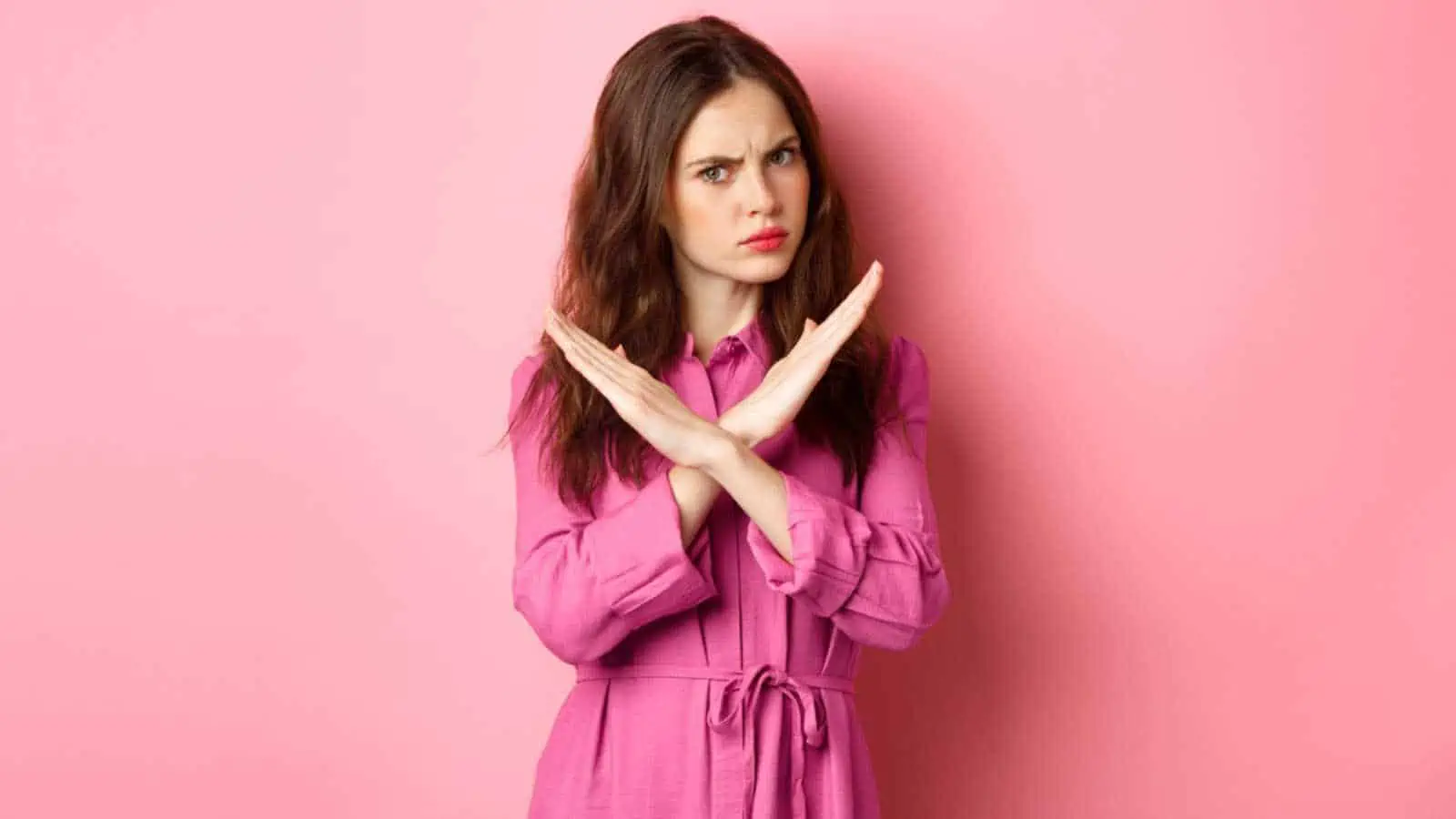 Angry woman crossing hands and saying no