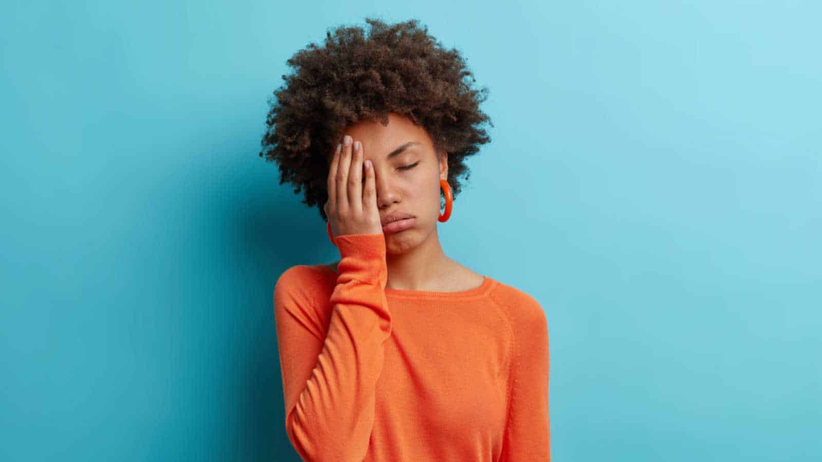 Woman with hands on face