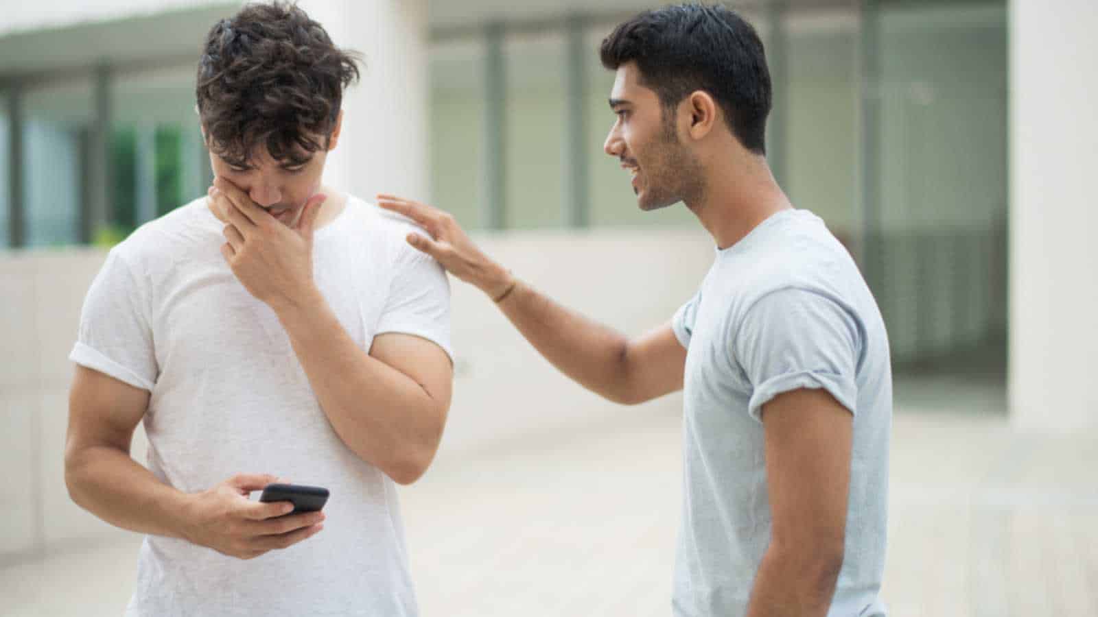 Man consoling his friend
