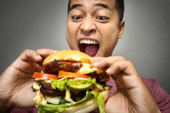 Man eating burger