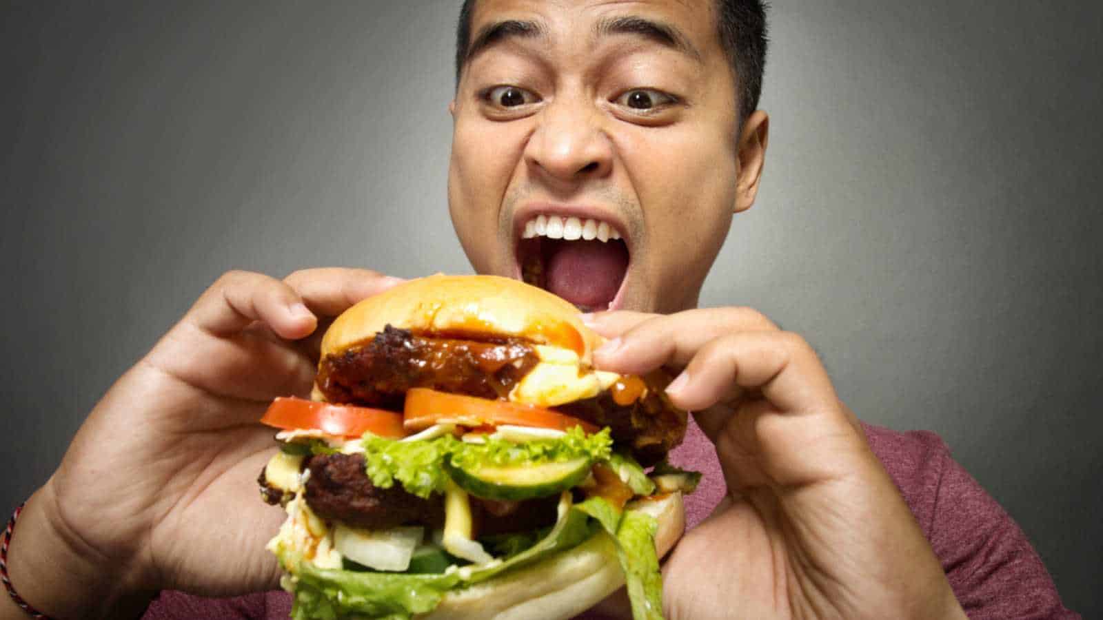 Man eating burger