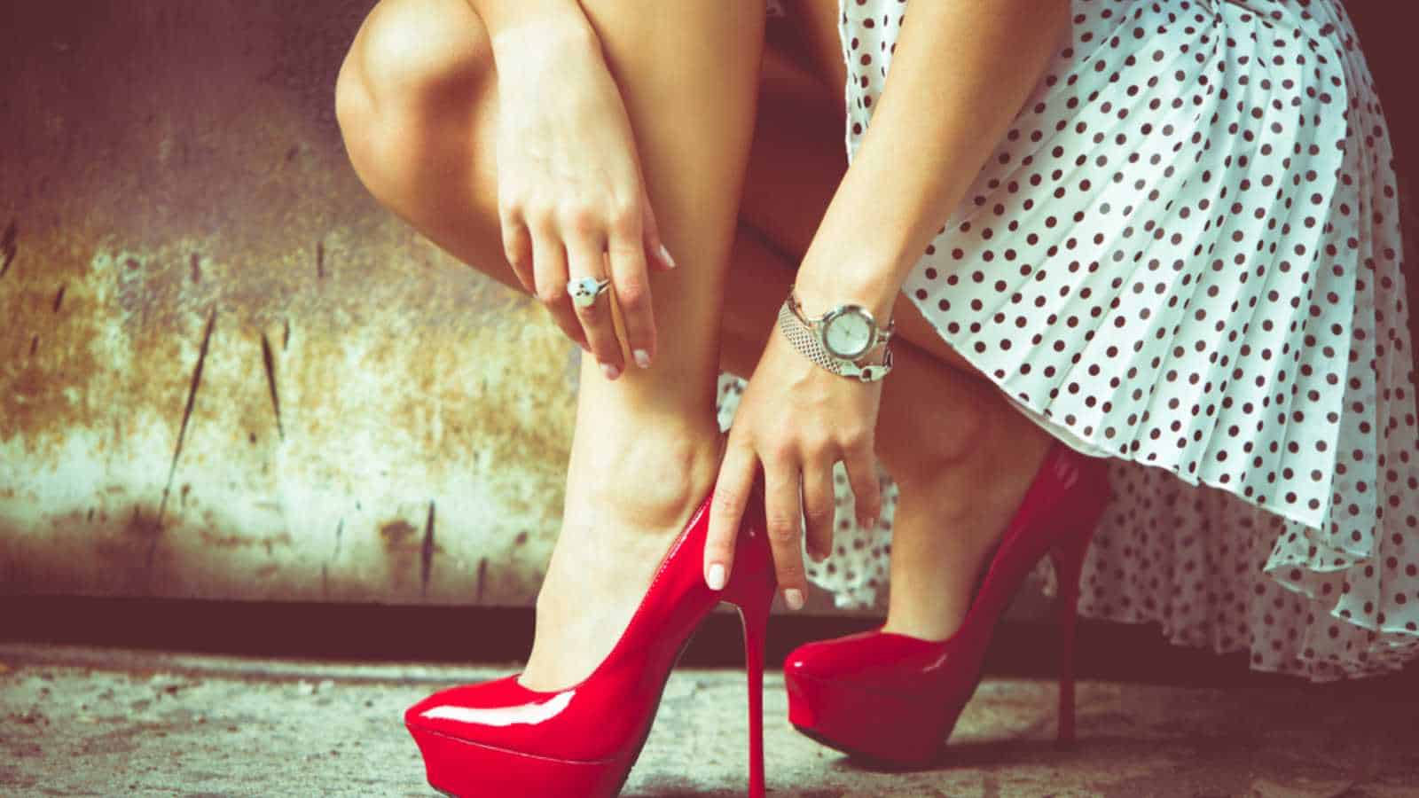 Woman removing shoe