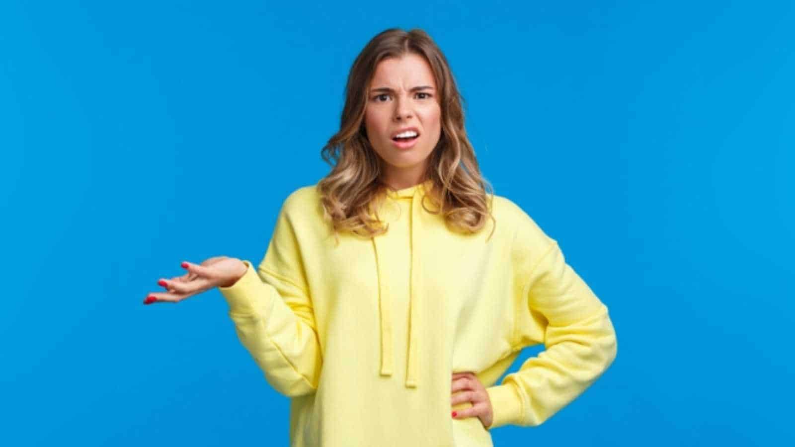 Woman shrugging and amazed