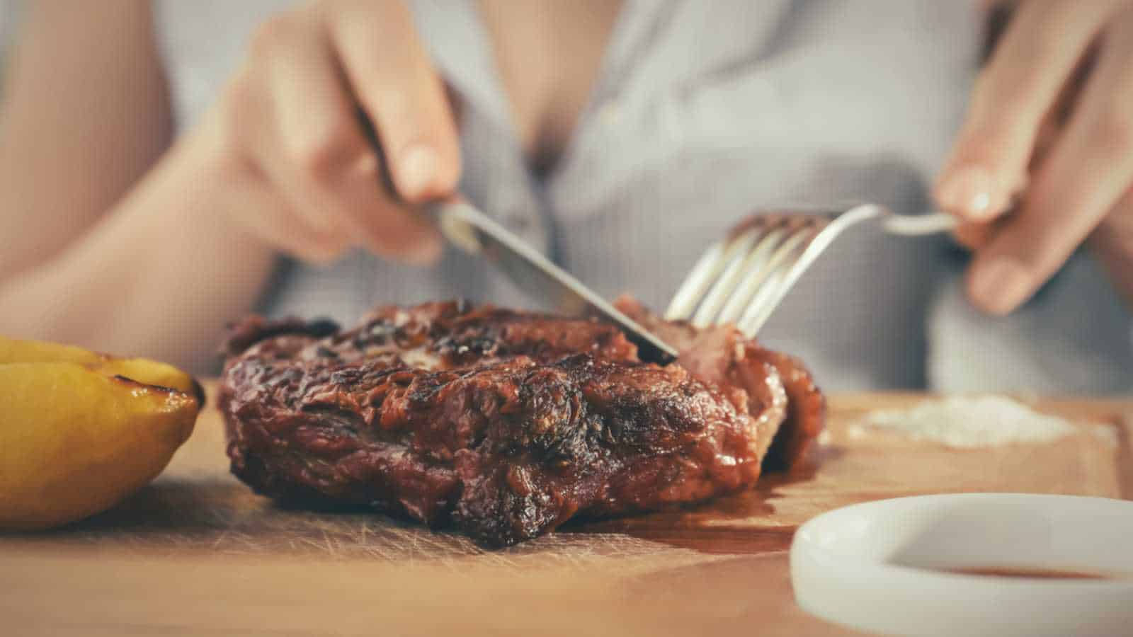 Woman using Knife and Fork