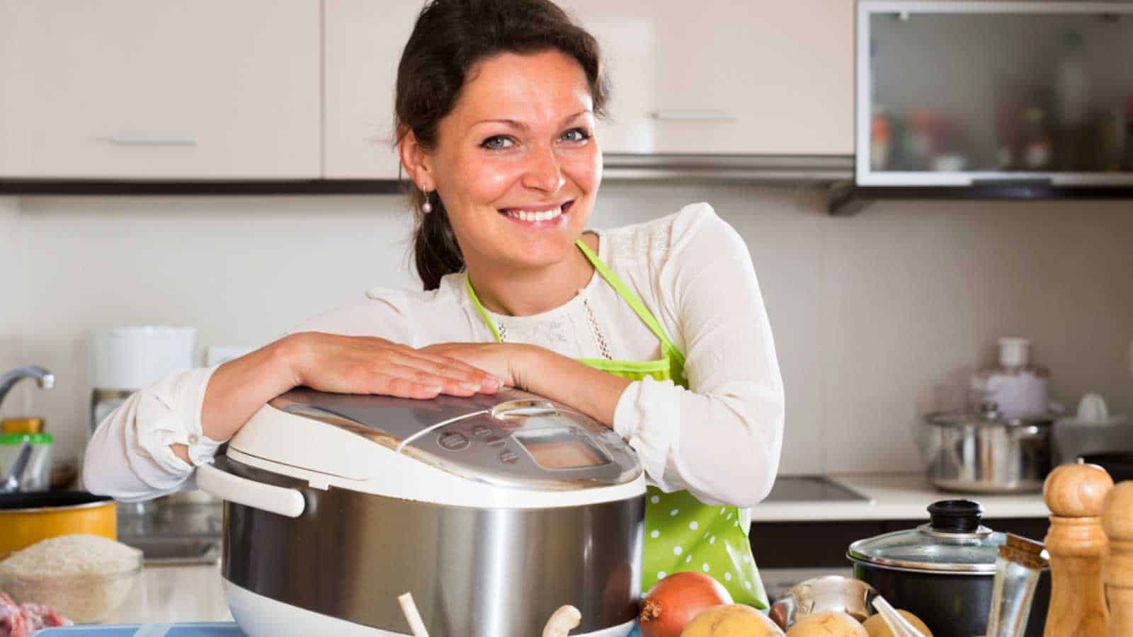 Woman using slow cooker