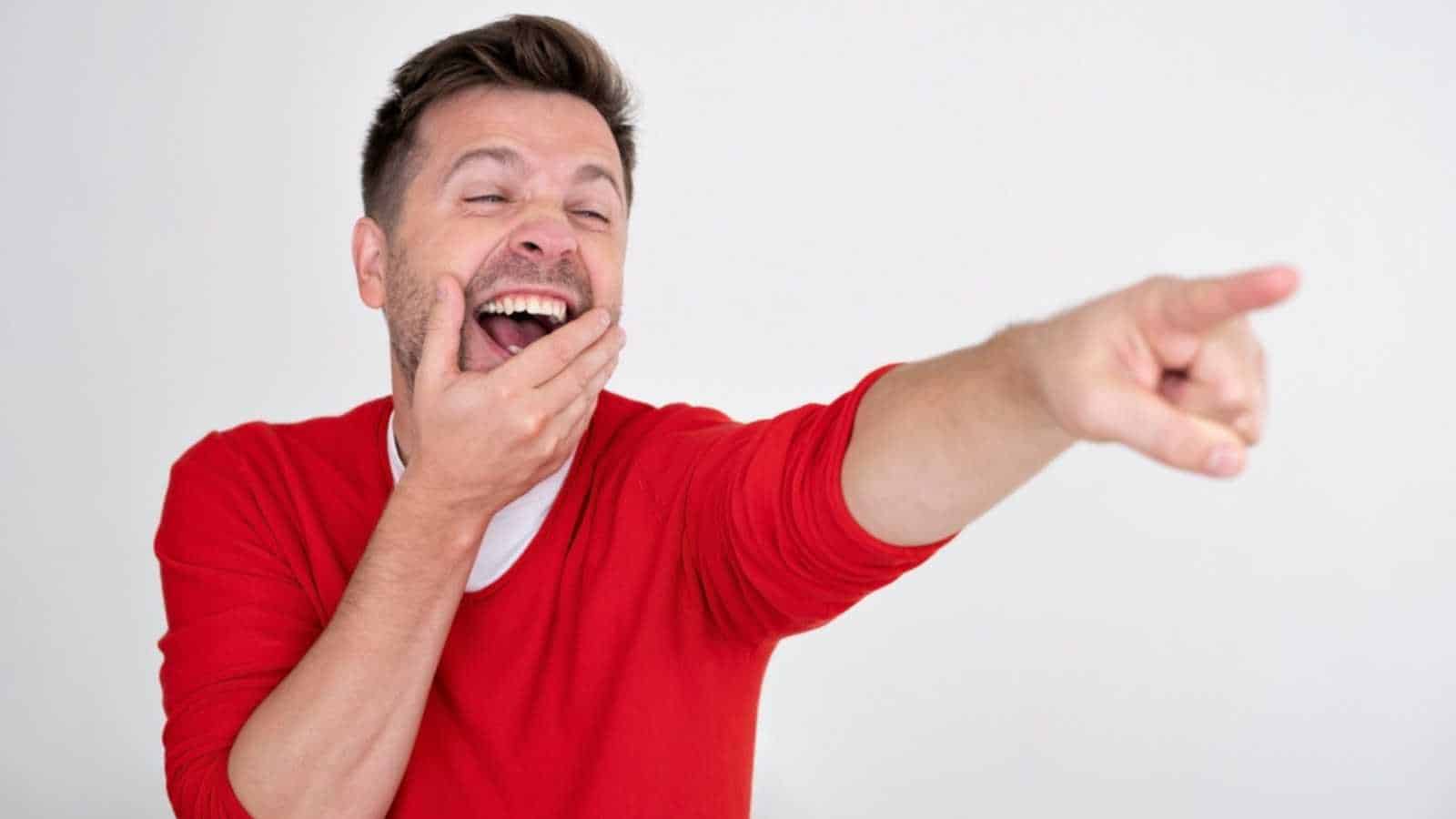 Man pointing and laughing