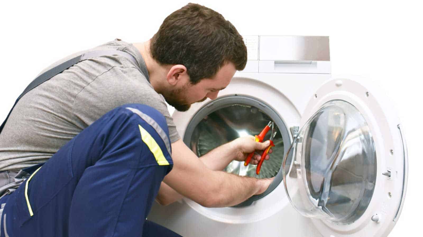 Man repairing washing machine