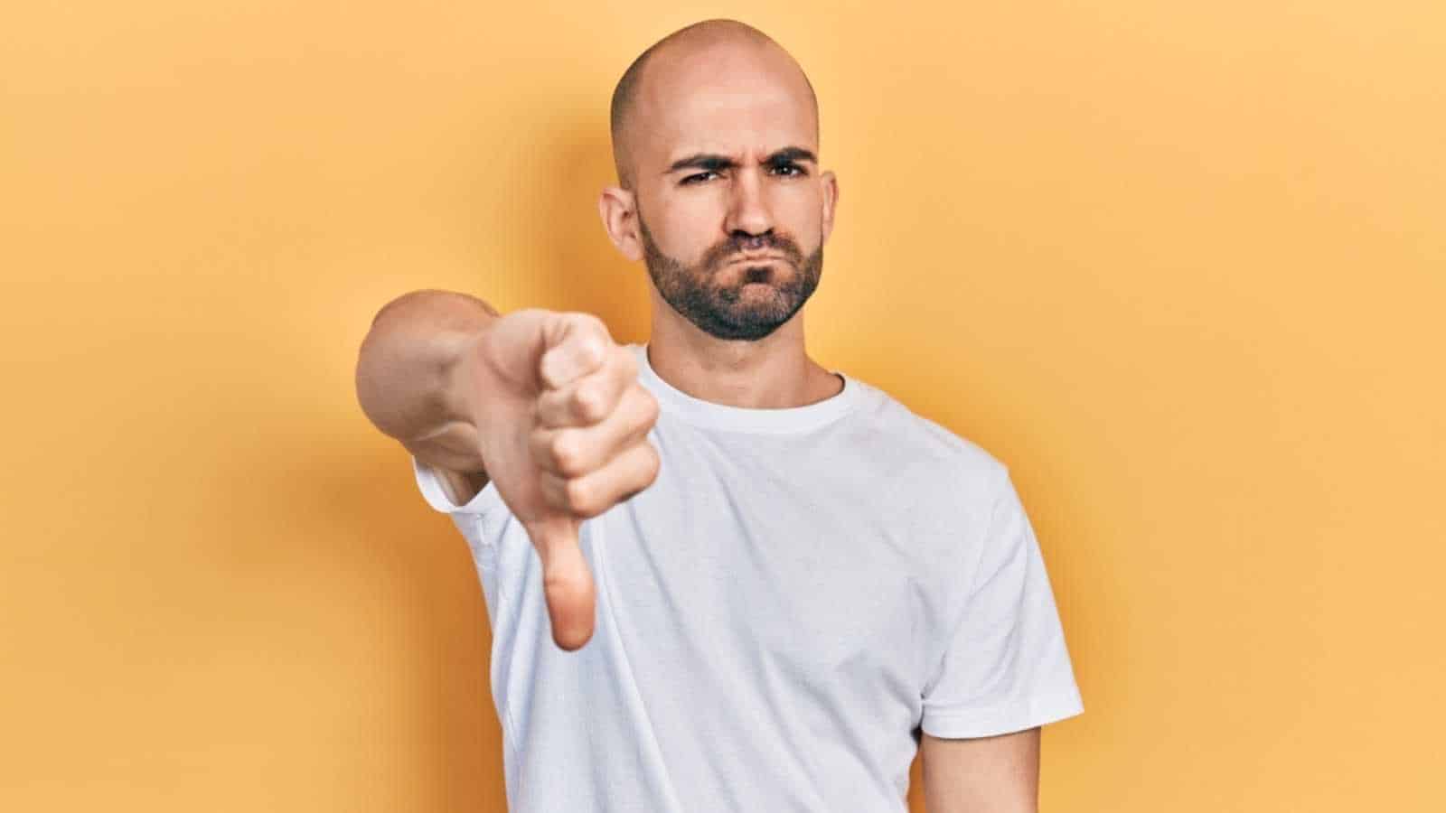 Man showing thumbs down