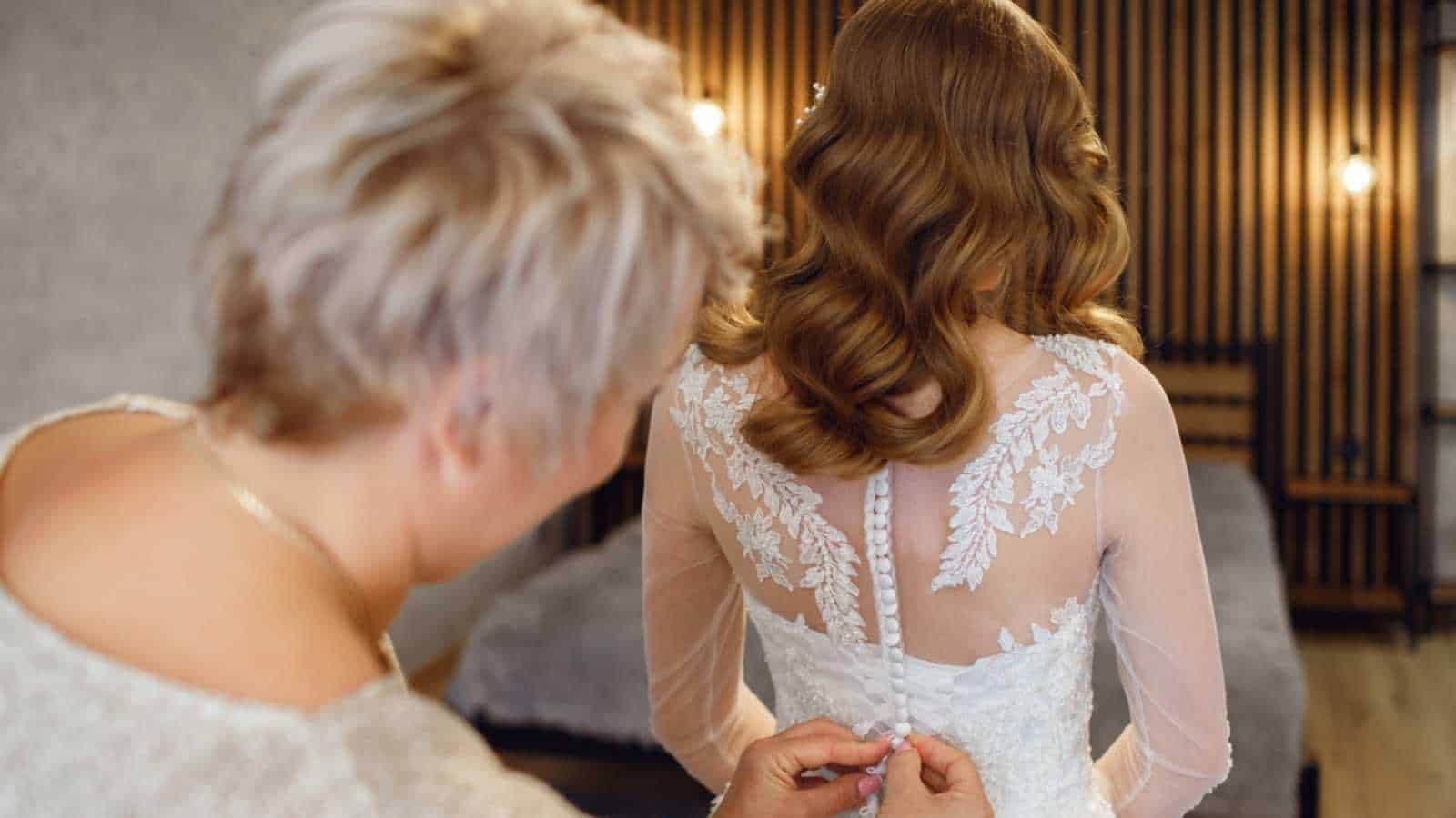 Mother and daughter trying wedding dress