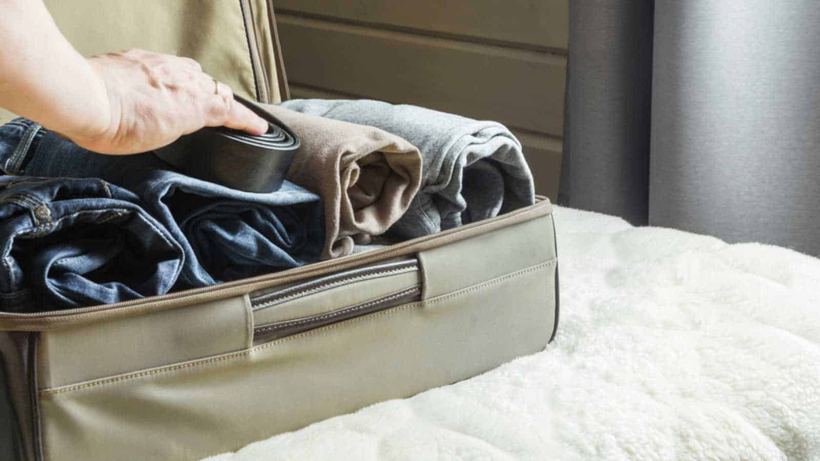 10 Hacks To Make Your Moving Day Affordable and Easy 44 Rolling clothes and packing