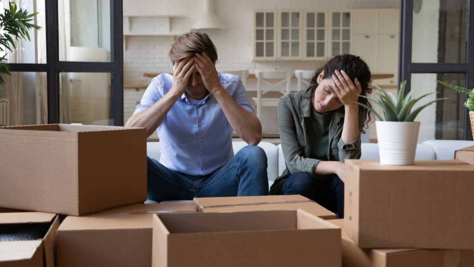 Stressed couple with boxes