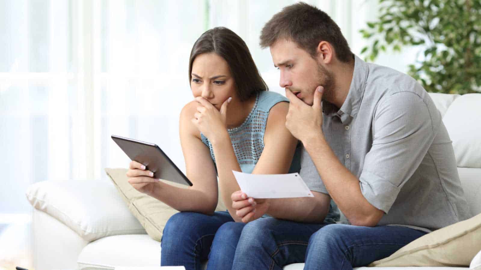 Stressed couples discussing tax