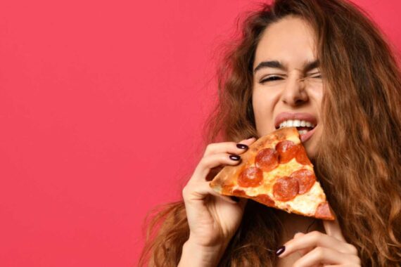 Woman eating Pizza