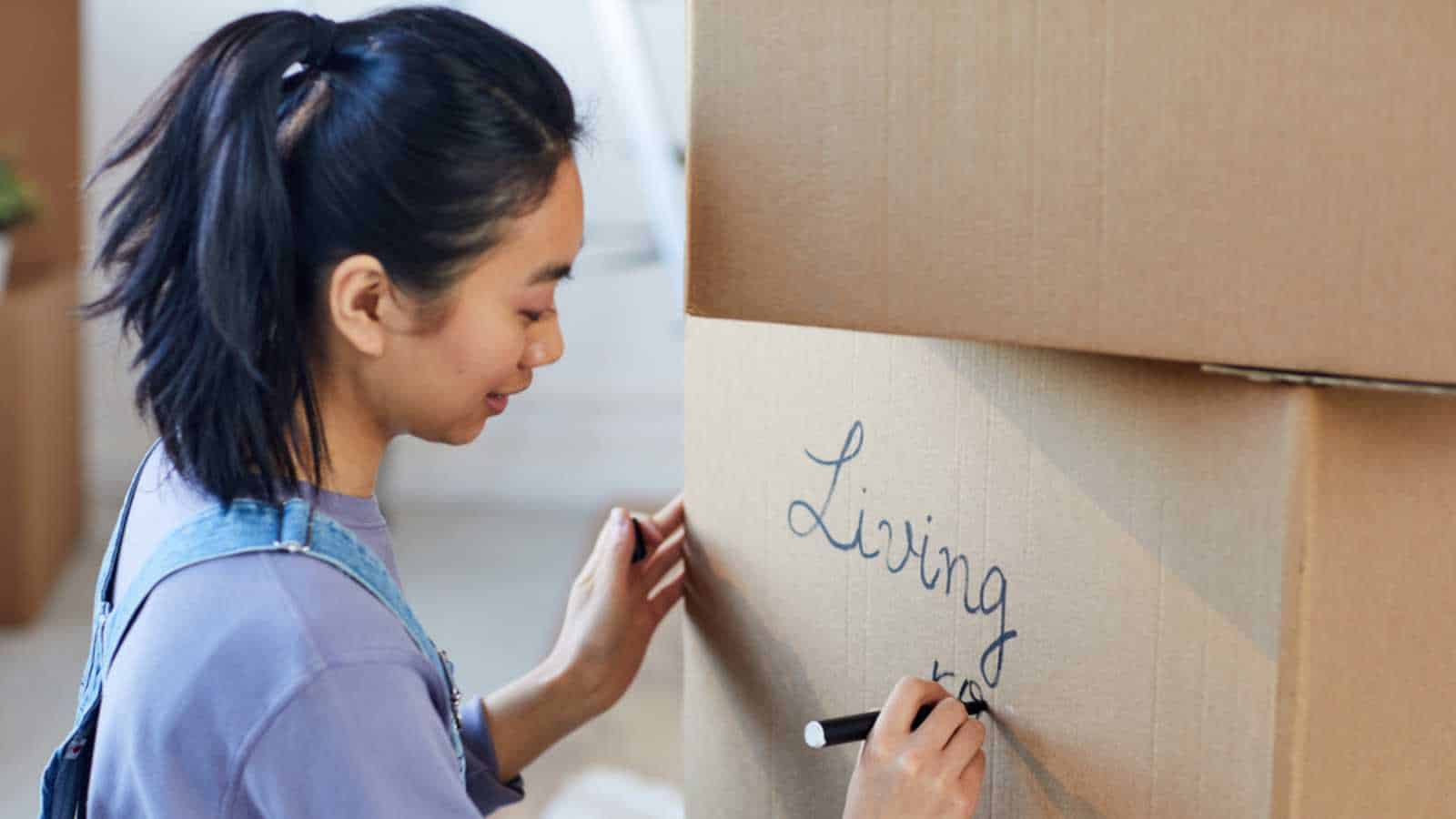 Woman labeling the box