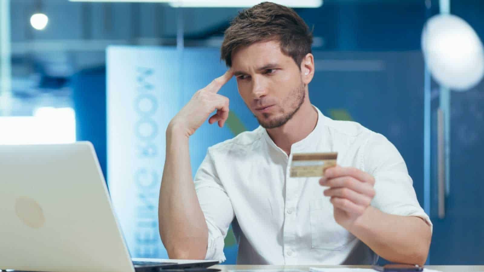Unhappy man with credit card