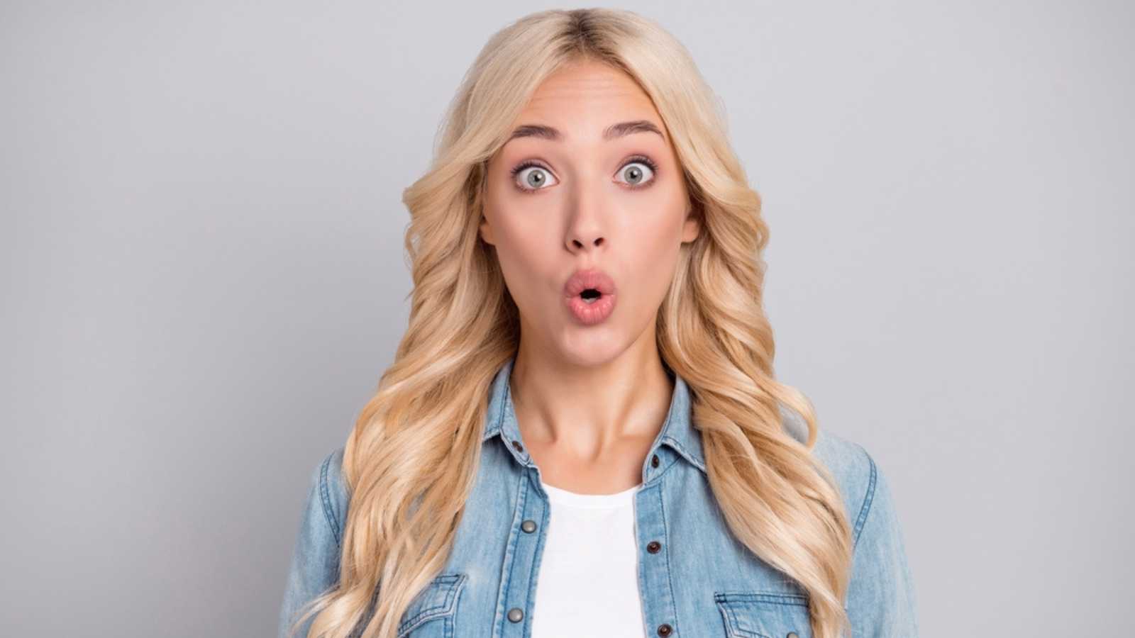 Impressed shocked young woman