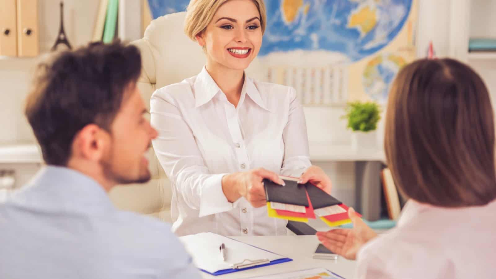 Couples talking to travel agent