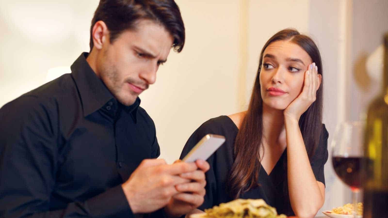 Man using mobile ignoring girlfriend