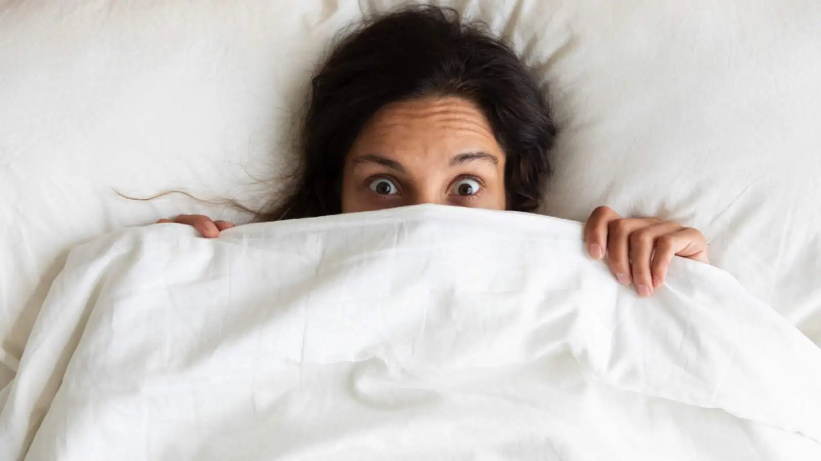 Woman using Red Land Cotton Sheets