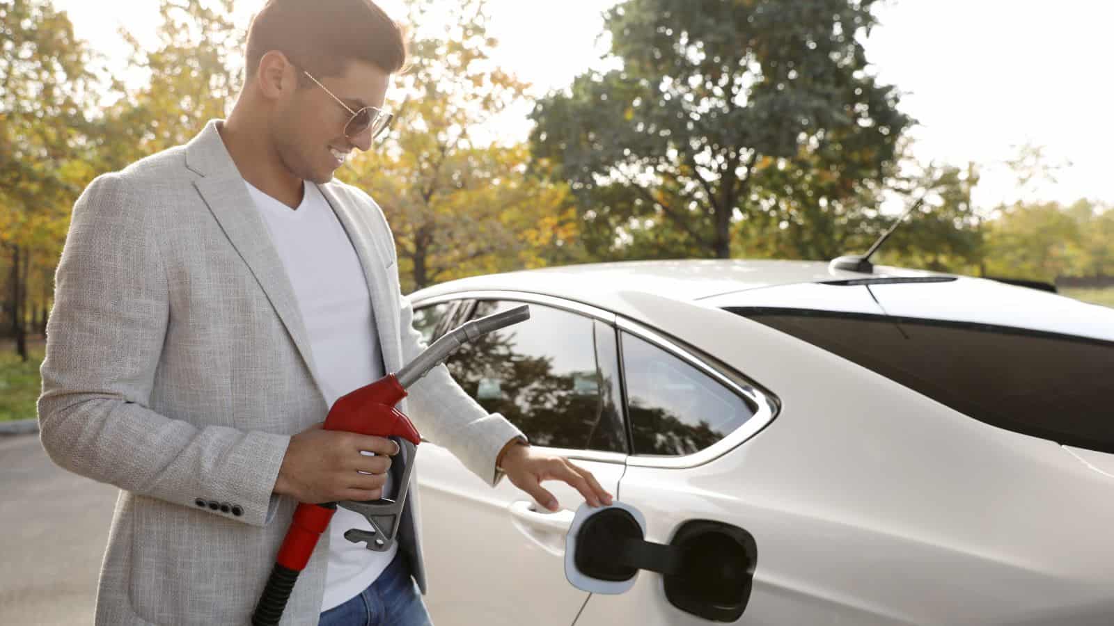 man pumping gas