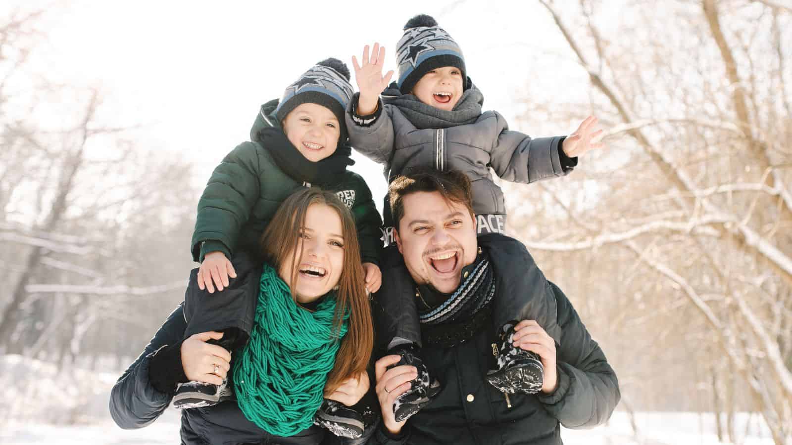 family having fun in snow