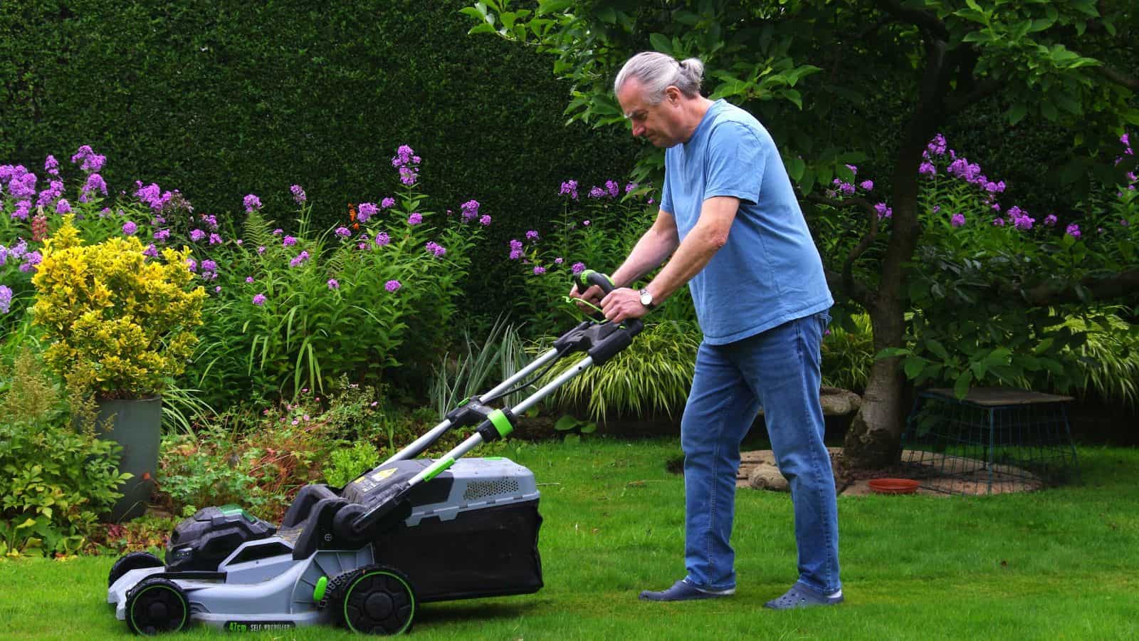 old man mowing